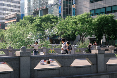 People sitting outside building