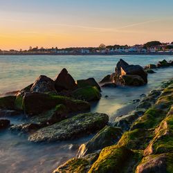 Scenic view of sea against sky during sunset