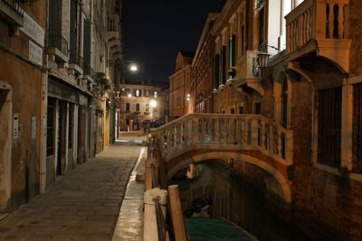Low angle view of buildings in city at night