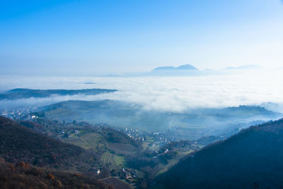 The fog rises from the plain between the berici hills in late autumn in villaga, vicenza italy