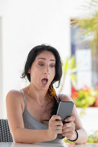 Young woman using mobile phone