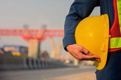 Close-up of man working at construction site