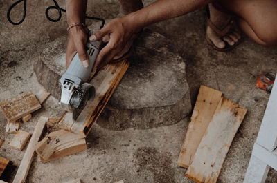 Low section of man working at workshop