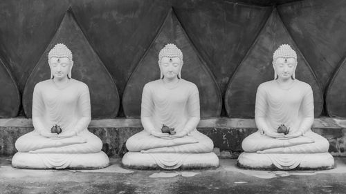 Statue of buddha statues in row
