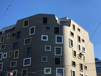 Low angle view of residential building against clear sky