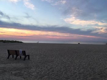 Scenic view of beach against sky during sunset