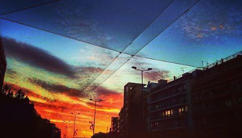 architecture, building exterior, built structure, low angle view, sky, sunset, city, power line, building, silhouette, cloud - sky, dusk, residential structure, street light, residential building, cloud, orange color, cable, no people, outdoors