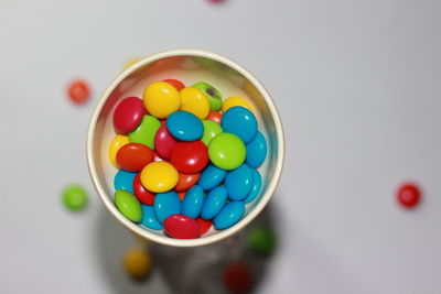 High angle view of multi colored candies in bowl