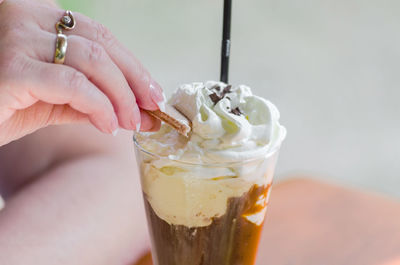 Close-up of hand and drink