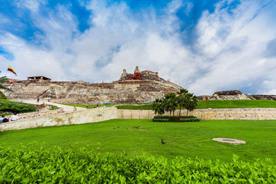 Traditional building against cloudy sky