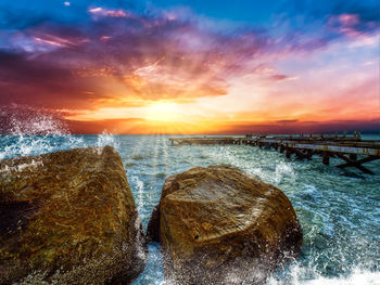 Scenic view of sea against sky during sunset