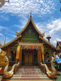 Low angle view of temple against building