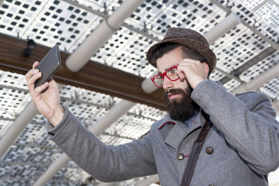 Young man using mobile phone