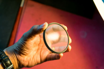 Close-up of hand holding eyeglasses