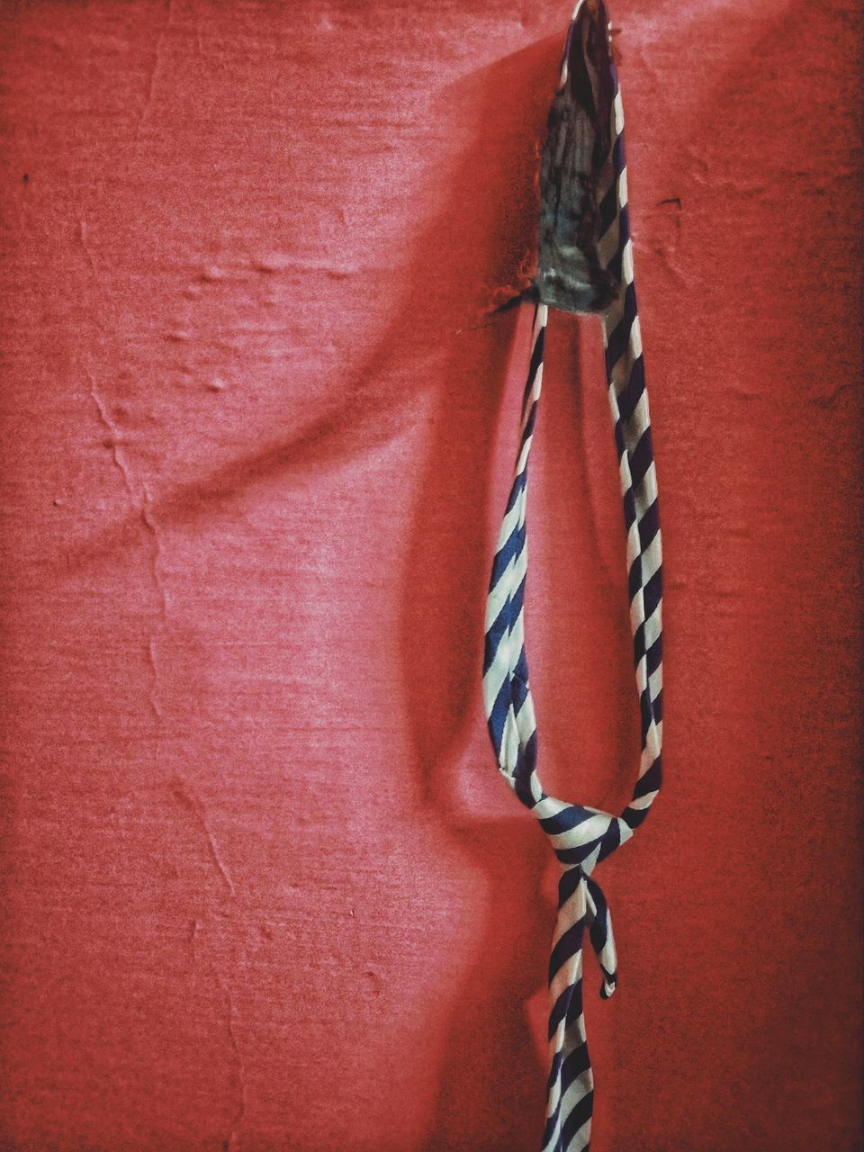 FULL FRAME SHOT OF TIED UP ON WALL
