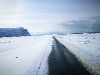 Scenic view of snow covered landscape against sky