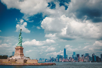 City skyline against cloudy sky