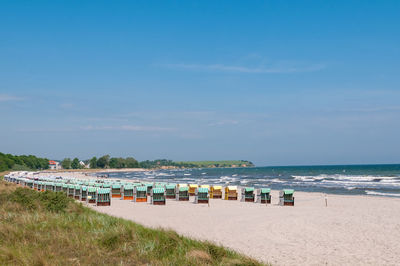 Scenic view of beach against blue sky