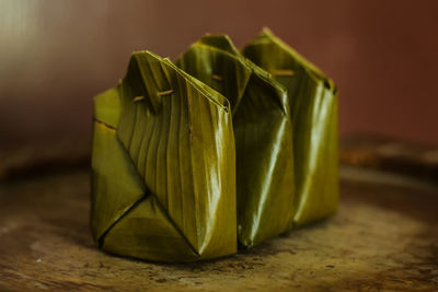 Close-up of green leaves on table