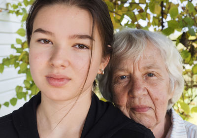 Close-up portrait of grandmother and granddaughter