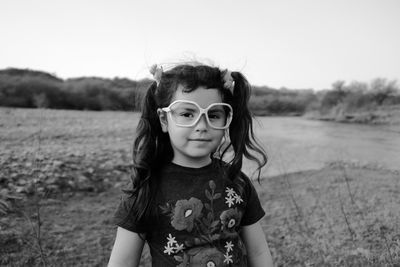 Portrait of happy girl on field