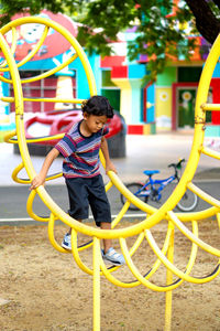 Full length of girl playing at playground