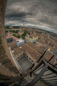 High angle view of cityscape against storm clouds