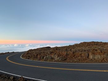 Scenic view of country road against sky