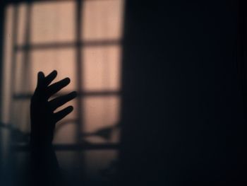 Silhouette hand in darkroom
