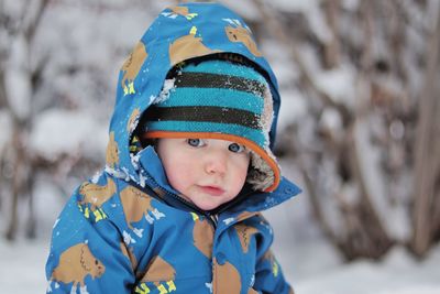 Portrait of cute boy in snow