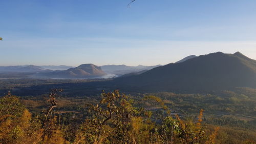 Scenic view of landscape and mountains against sky