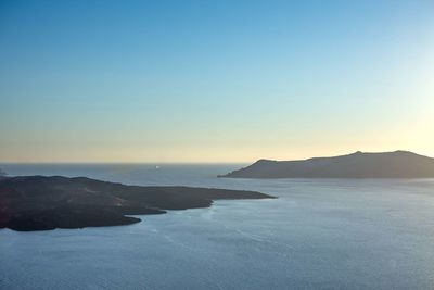 Scenic view of sea against clear sky during sunset