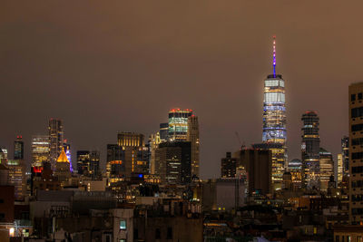 Illuminated freedom tower in new york city at night.