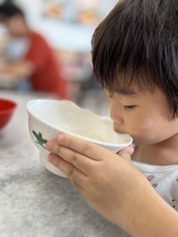 Close-up of boy eating food