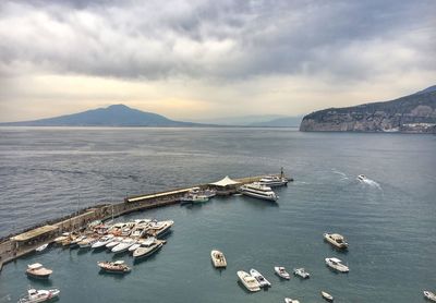 High angle view of boats in sea against sky