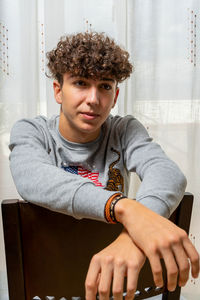 Portrait of young man sitting outdoors