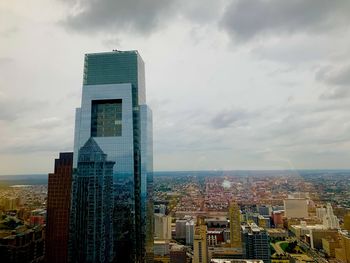 Modern buildings in city against sky