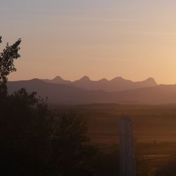 Scenic view of mountains at sunset