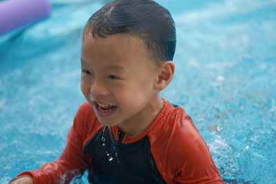 Boy swimming in pool