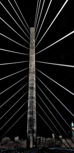 Low angle view of suspension bridge against sky