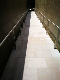 Shadow of railing on footpath