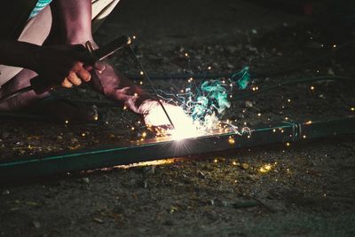 Close-up of man welding metal in industry