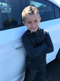 Portrait of smiling boy in car