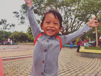 Portrait of happy girl in park