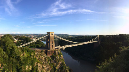View of bridge over river against cloudy sky