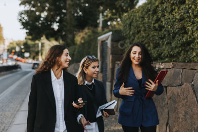 Female coworkers walking together