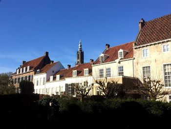 Buildings against blue sky and clouds