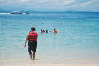 Male friends on shore