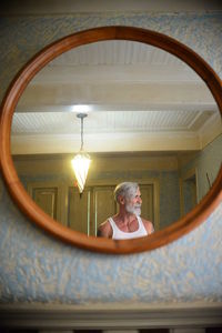 Low angle view of woman in illuminated lamp