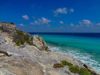 Scenic view of sea against blue sky